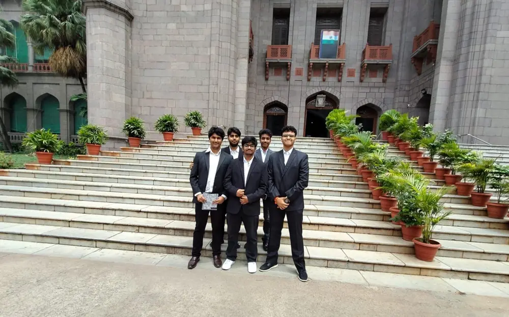 Internship group in suits on the High Court steps