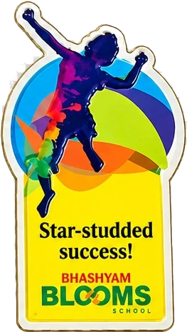 Yellow magnet with a leaping figure reading Star-studded success!, Bhashyam Blooms School